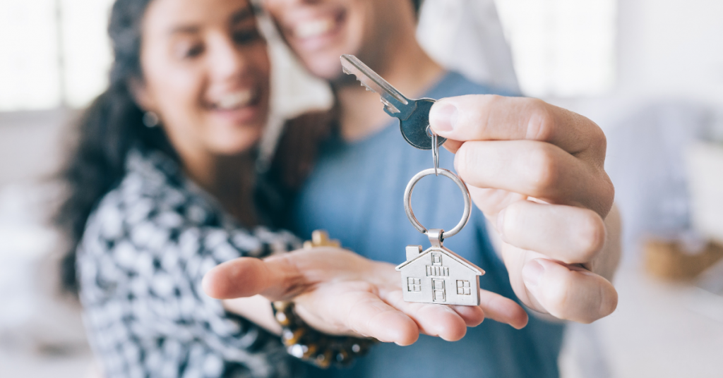 couple with house keys in hand
